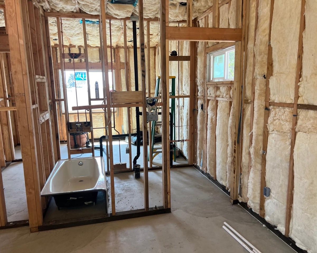 Bathroom remodel rough-in by A+ Electric & Plumbing in Los Angeles: new drain, water lines and wiring framed in before finishing.
