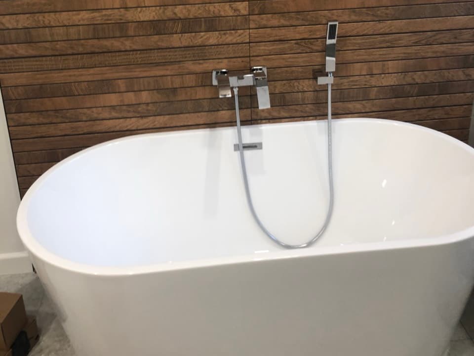Tub installation, recent Los Angeles job | A+ Electric & Plumbing Freestanding tub with wall-mounted filler installed by A+ Electric & Plumbing in a Los Angeles bathroom.